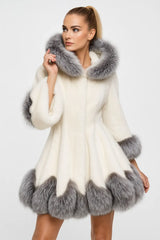 Luxury women’s white faux fur coat with silver fox trim – elegant winter fashion